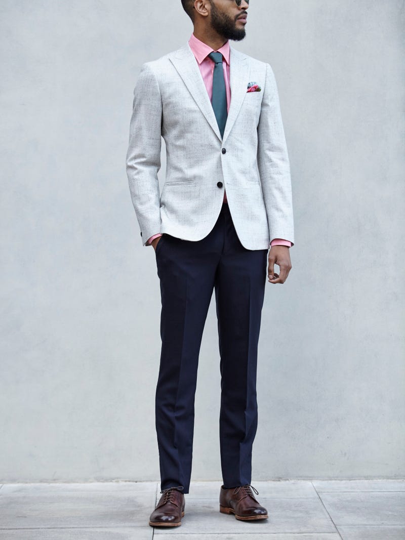 Men's outfit idea for 2022 with linen blazer, colored dress shirt, navy dress pants, patterned pocket square, oxford / derby shoes. Suitable for summer.