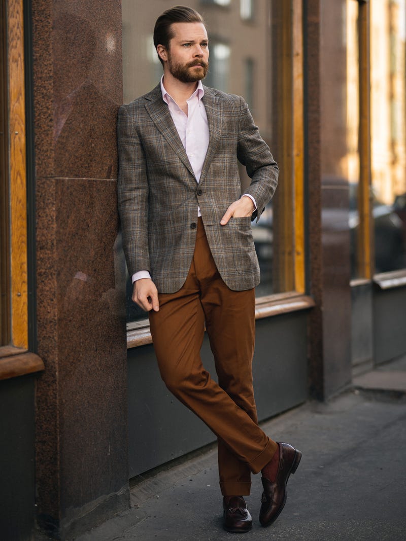 Men's outfit idea for 2022 with pink striped dress shirt, brown chinos, brown loafers. Suitable for spring, summer and fall.